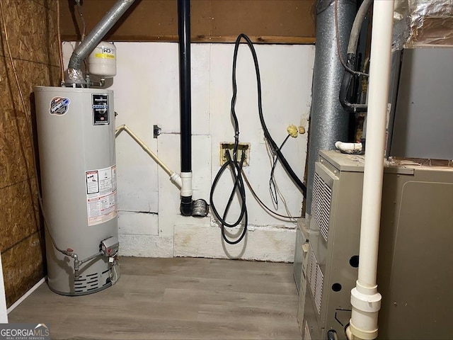 utilities featuring water heater and heating unit