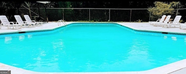 view of pool featuring a patio, fence, and a fenced in pool