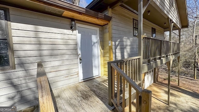 entrance to property with a deck