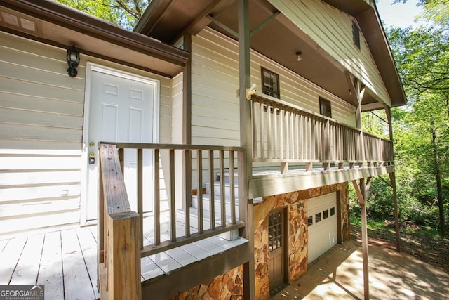wooden deck with a garage