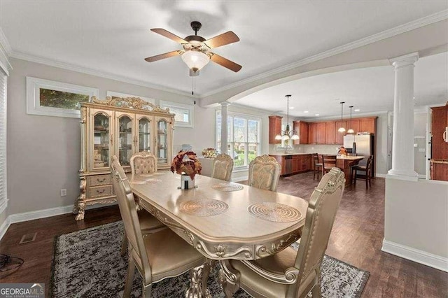 dining space with ceiling fan, ornamental molding, dark hardwood / wood-style flooring, and ornate columns