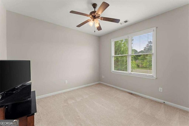 carpeted empty room with ceiling fan