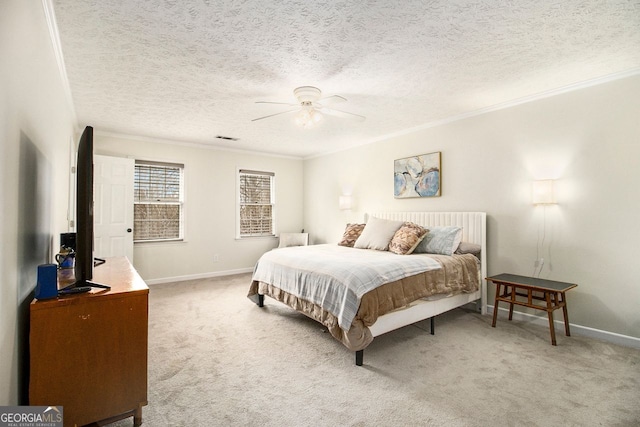 bedroom featuring crown molding, carpet, a textured ceiling, and ceiling fan