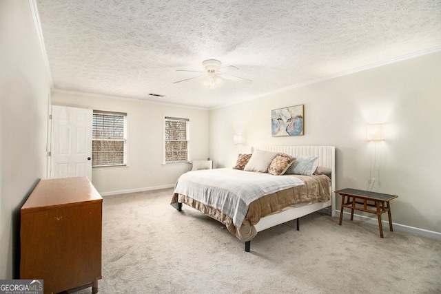 bedroom featuring ornamental molding, carpet flooring, a textured ceiling, and ceiling fan