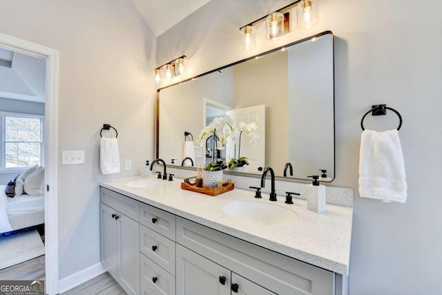 bathroom featuring vanity and wood-type flooring