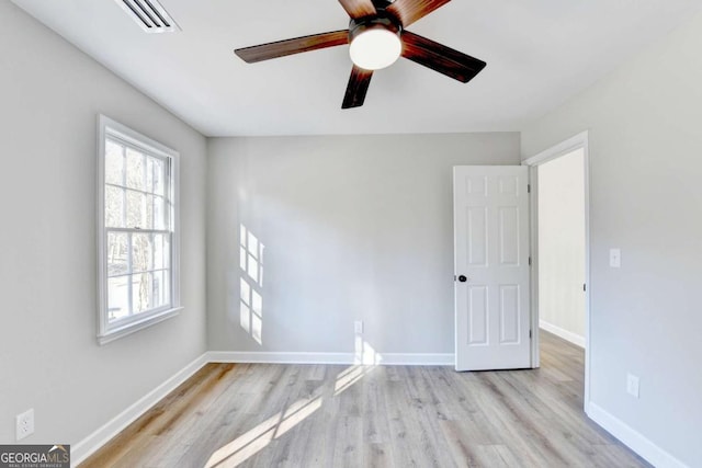 spare room with ceiling fan and light hardwood / wood-style floors