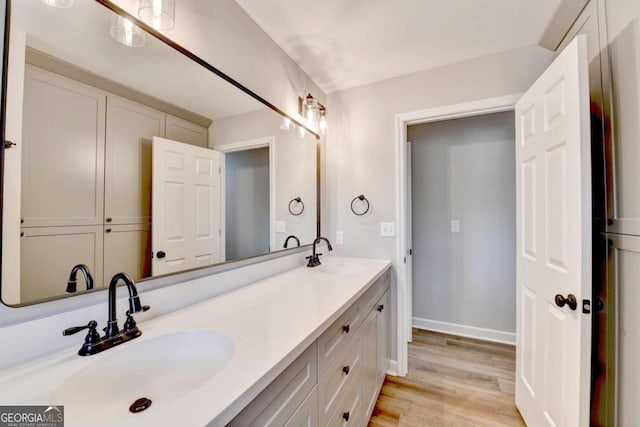 bathroom featuring hardwood / wood-style flooring and vanity