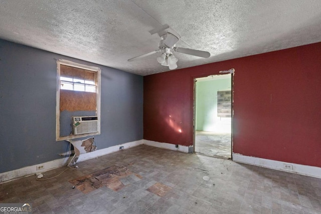 unfurnished room featuring a textured ceiling and ceiling fan