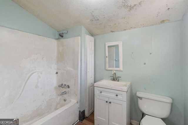 full bathroom with lofted ceiling, toilet,  shower combination, vanity, and hardwood / wood-style flooring