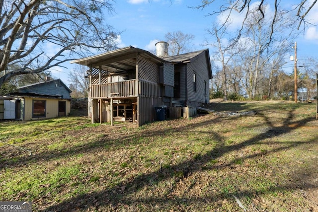 view of home's exterior with a yard