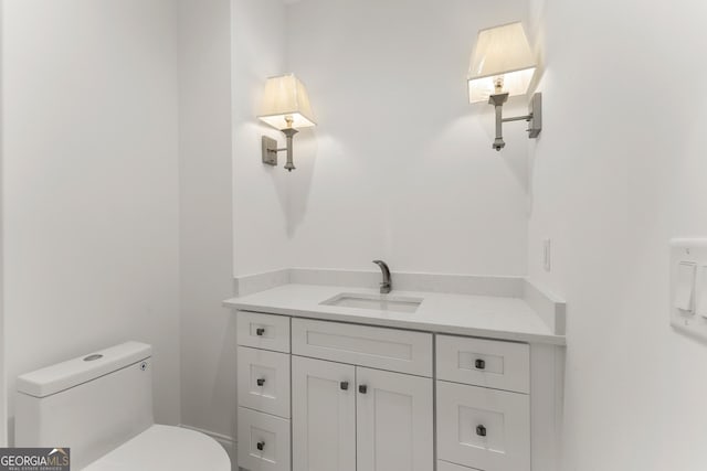 bathroom with vanity and toilet