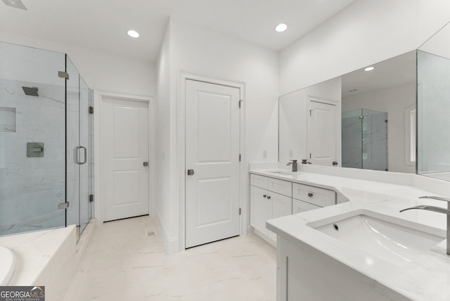 bathroom with vanity and walk in shower