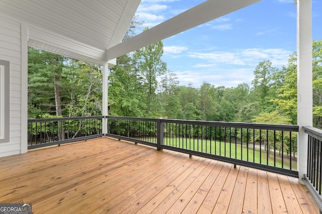 deck featuring a lawn