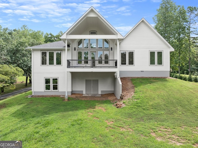 rear view of house with a lawn