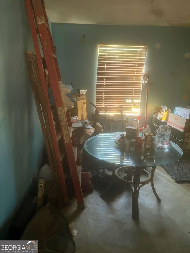 dining room with concrete floors