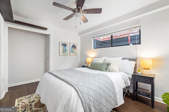 bedroom featuring ceiling fan and dark hardwood / wood-style floors