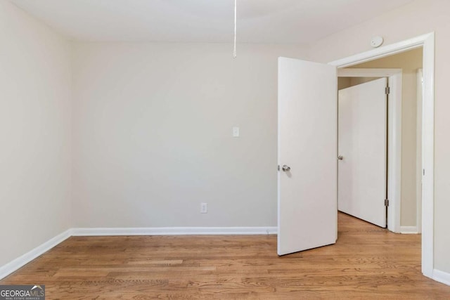 spare room with light hardwood / wood-style flooring