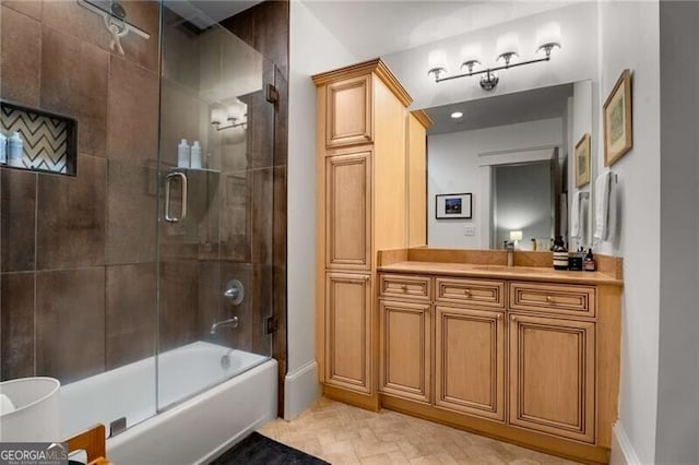 bathroom featuring enclosed tub / shower combo and vanity