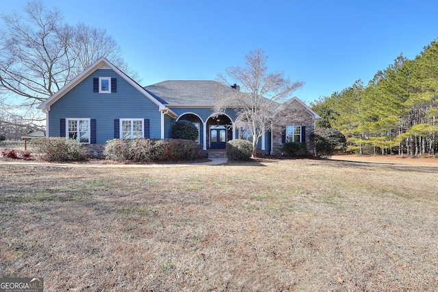 view of property featuring a front yard