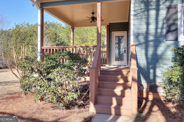 wooden deck with ceiling fan and covered porch