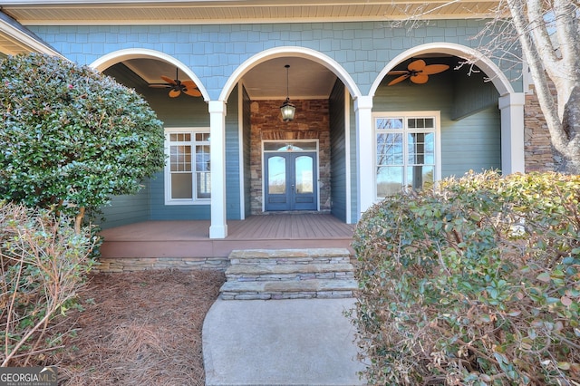 entrance to property featuring covered porch and french doors