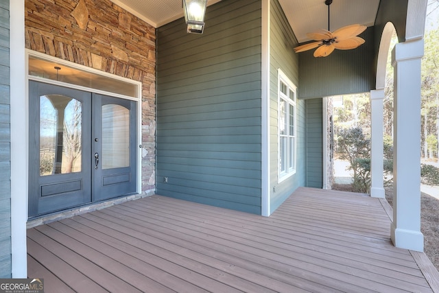 doorway to property featuring ceiling fan and french doors