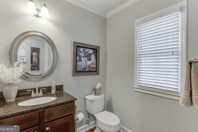 bathroom featuring vanity, ornamental molding, and toilet