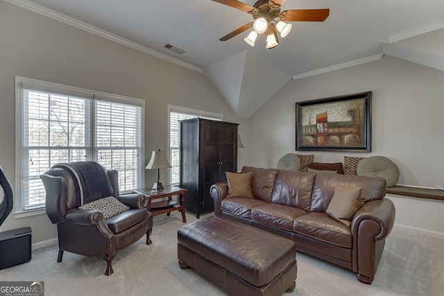 living room featuring vaulted ceiling, ornamental molding, light colored carpet, and ceiling fan