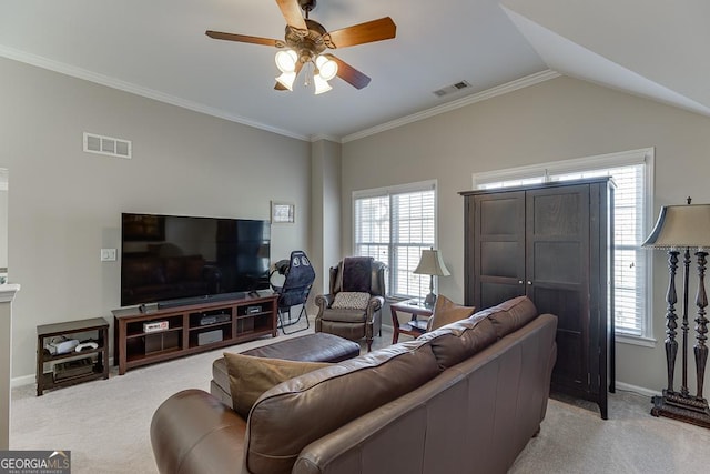 living room featuring a wealth of natural light, light colored carpet, and ceiling fan