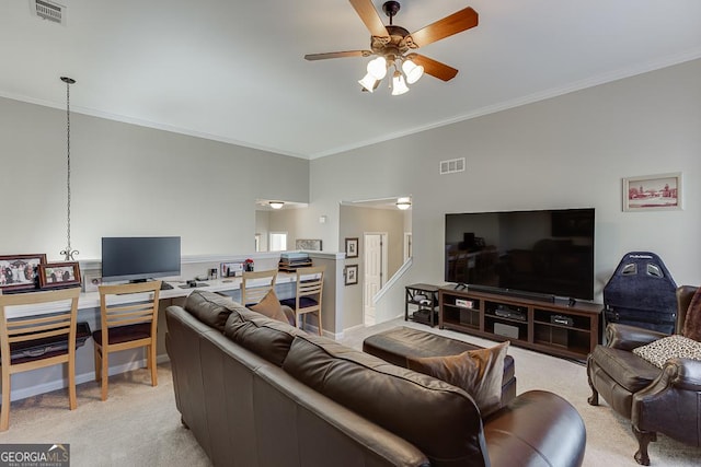 living room featuring ceiling fan, light colored carpet, and crown molding