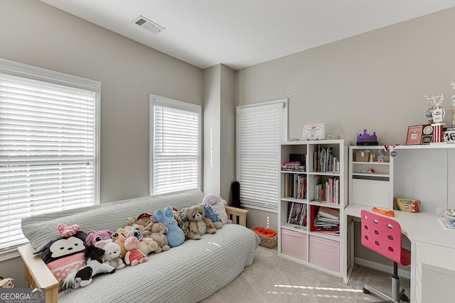 bedroom featuring light carpet