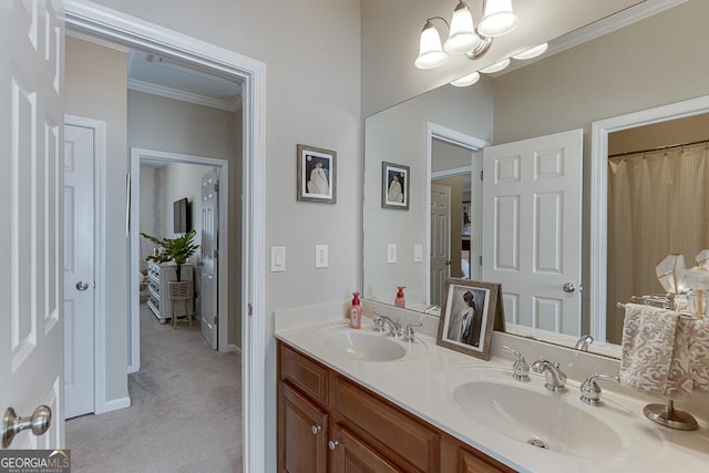 bathroom with vanity, a notable chandelier, and ornamental molding