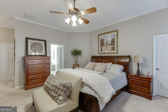 bedroom with ceiling fan, light colored carpet, ornamental molding, and connected bathroom