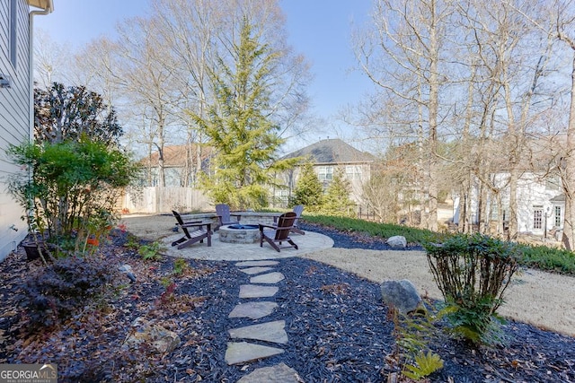 view of yard featuring a patio area and an outdoor fire pit