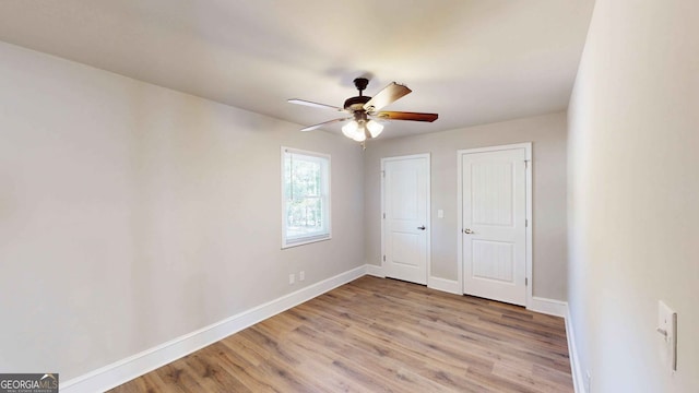 unfurnished bedroom featuring light hardwood / wood-style floors and ceiling fan