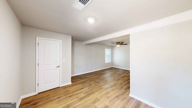 unfurnished room featuring ceiling fan and light hardwood / wood-style flooring