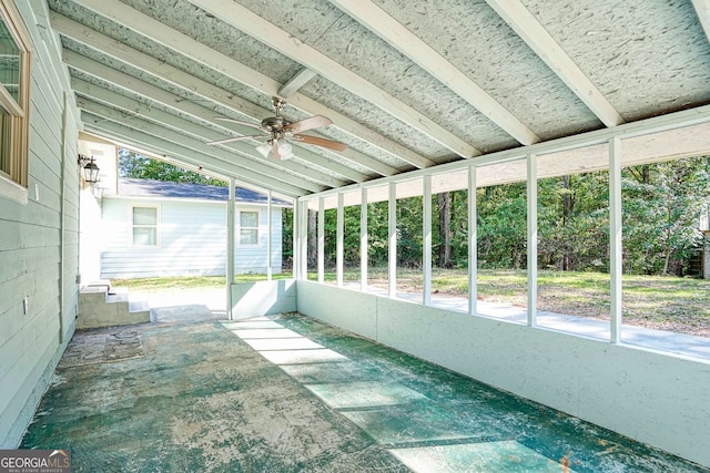 unfurnished sunroom with ceiling fan and lofted ceiling