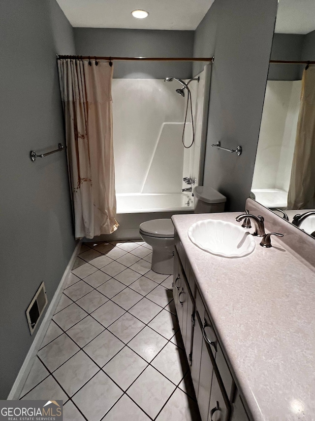 bathroom featuring shower / tub combo with curtain, visible vents, toilet, vanity, and tile patterned flooring