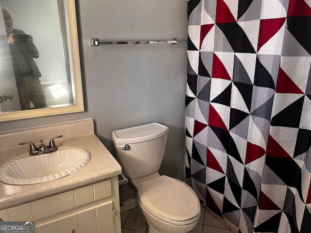 bathroom with vanity, toilet, and a shower with curtain