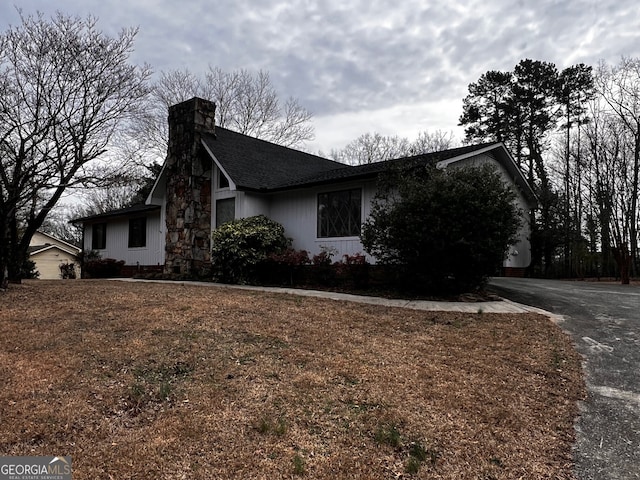 view of home's exterior with a chimney