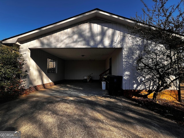 view of side of property with driveway