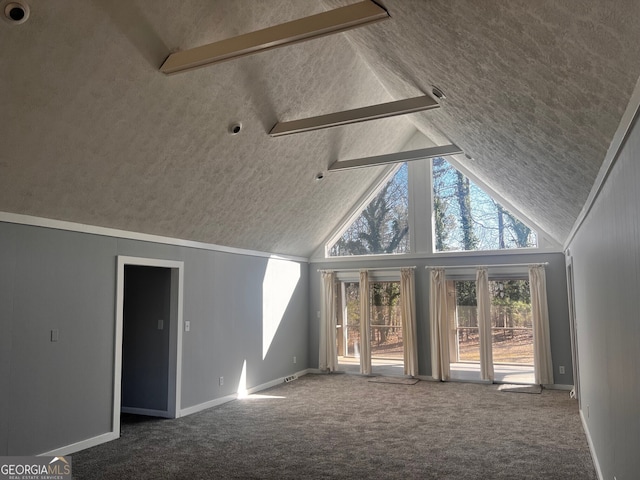 interior space featuring high vaulted ceiling, carpet flooring, beamed ceiling, and baseboards