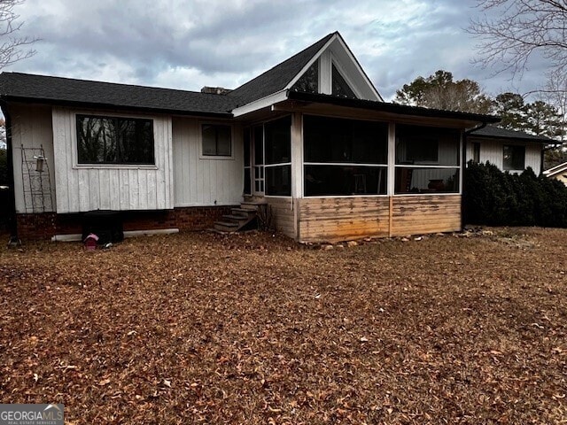 view of front of property with a sunroom