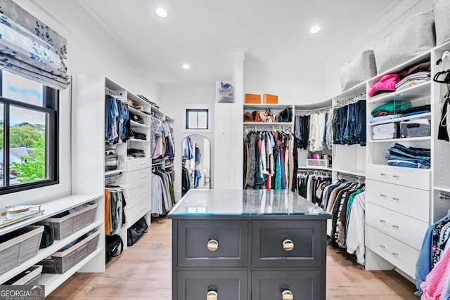 spacious closet featuring light hardwood / wood-style flooring