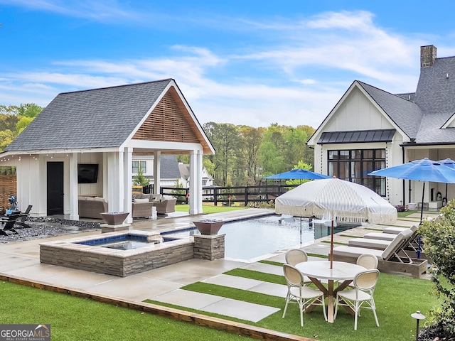 exterior space featuring an outdoor living space with a fireplace and a fenced in pool