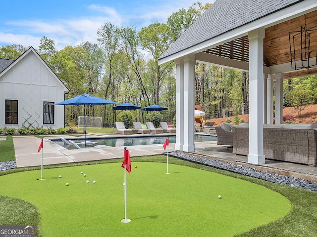 view of property's community with an outdoor living space, a swimming pool, a patio, and a gazebo