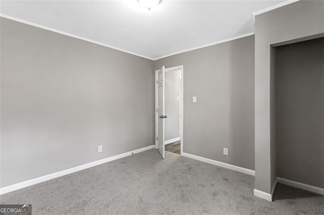 unfurnished bedroom with crown molding and light carpet