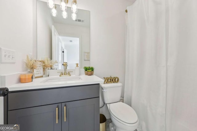 bathroom with vanity and toilet