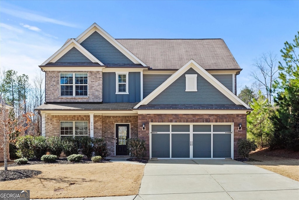 craftsman house with a garage