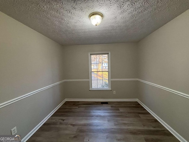 unfurnished bedroom with dark hardwood / wood-style flooring, a closet, and a textured ceiling